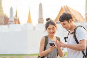 Traveler Asian couple direction on location map in Bangkok, Thai