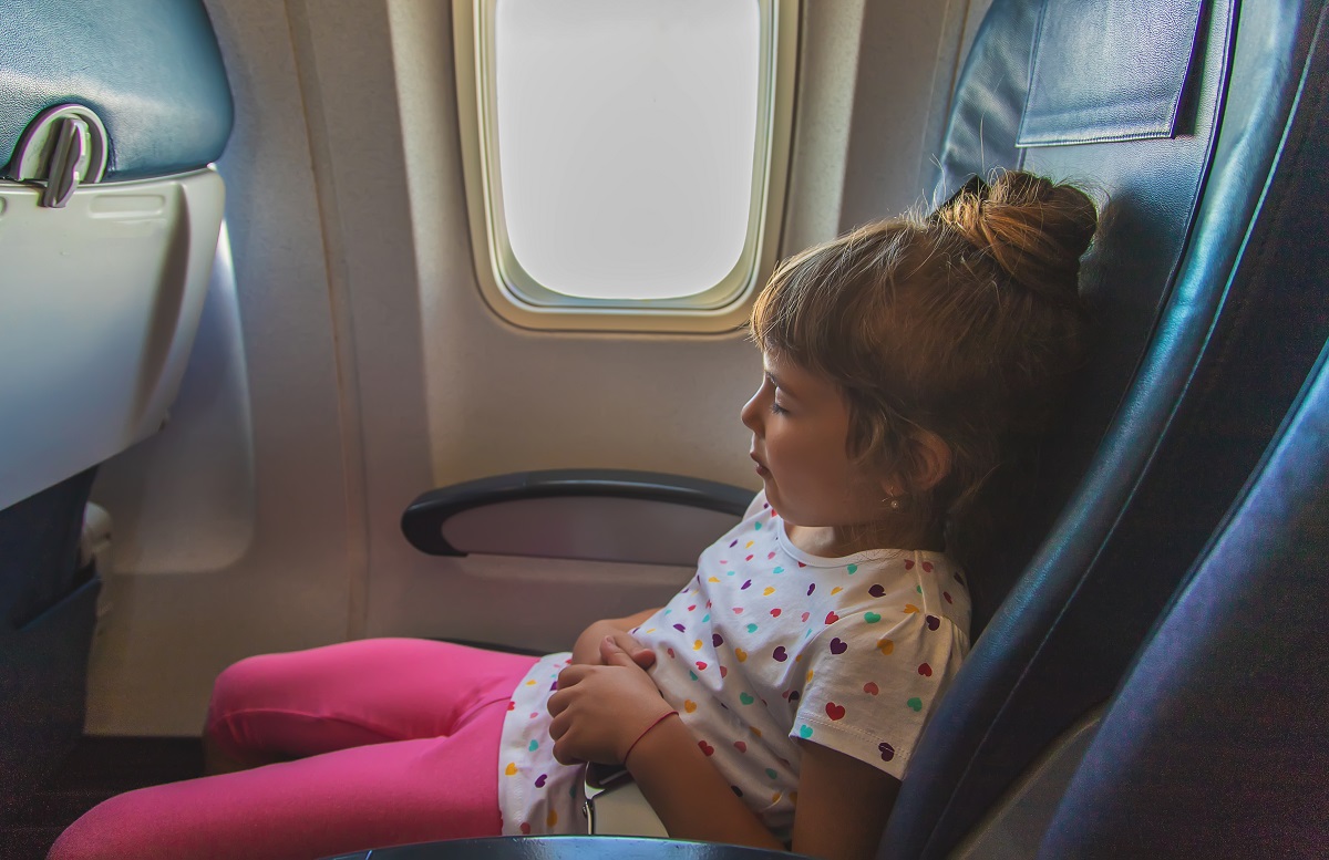 The child is sleeping on the plane. Selective focus.