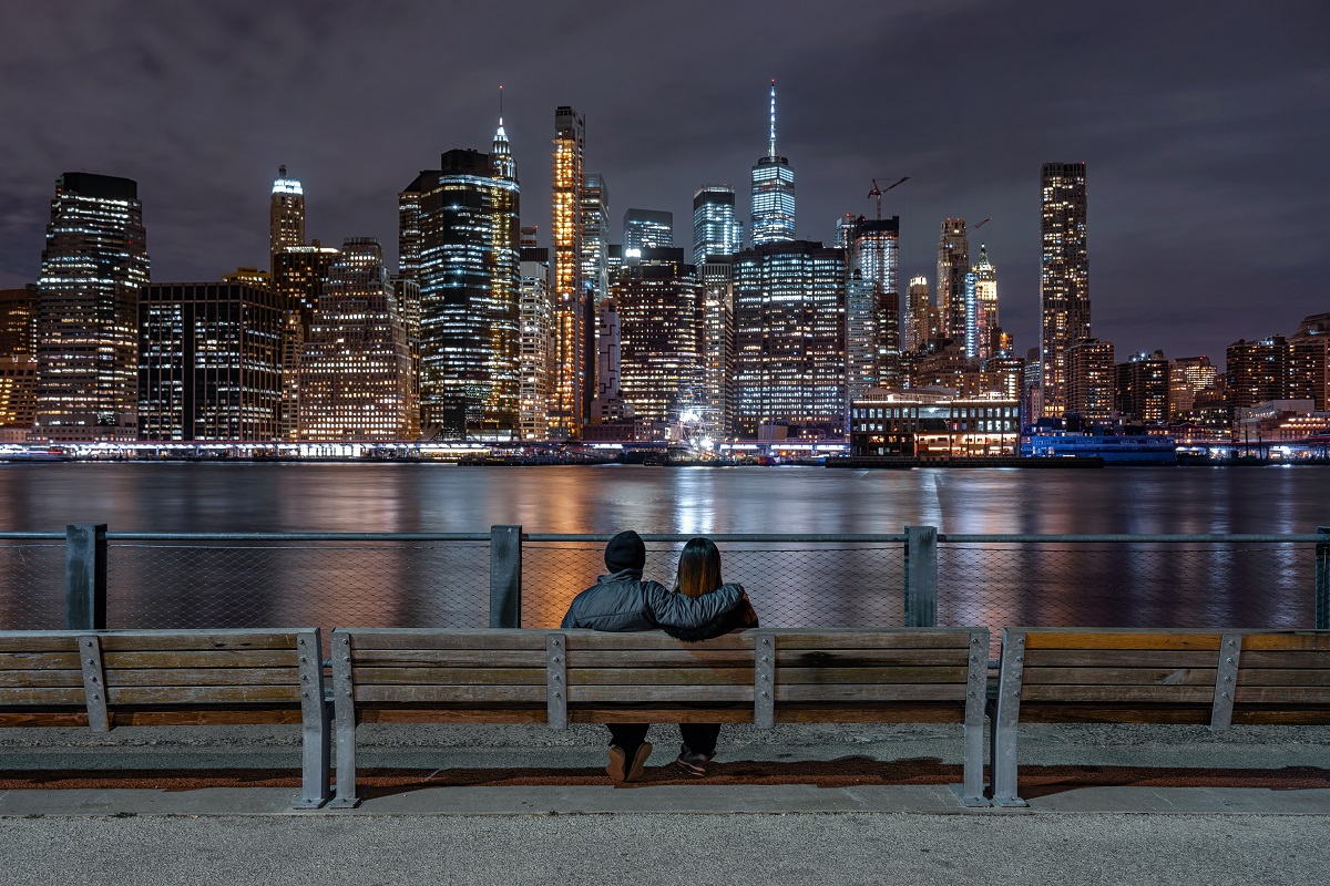 Scene of back side couple sitting and looking New york Cityscape